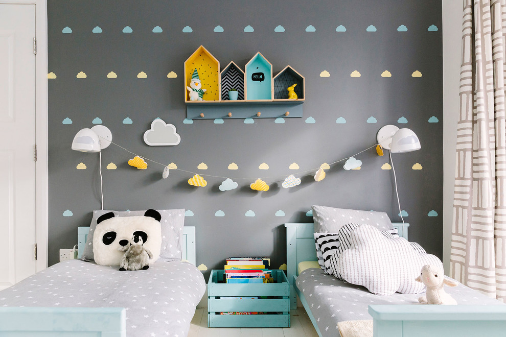 Inspiration for a modern gender-neutral kids' room remodel in London with gray walls