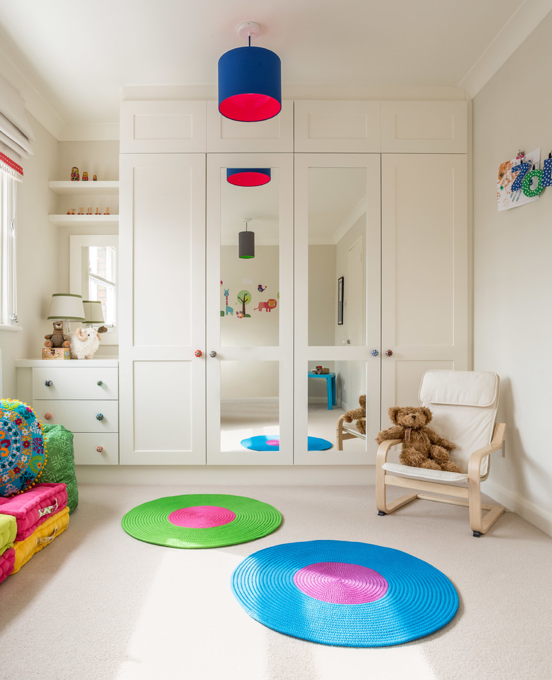 Inspiration for a mid-sized timeless girl carpeted kids' room remodel in Hampshire with beige walls