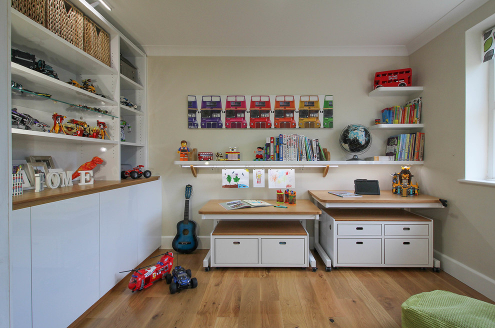 Photo of a contemporary playroom in London with medium hardwood flooring.