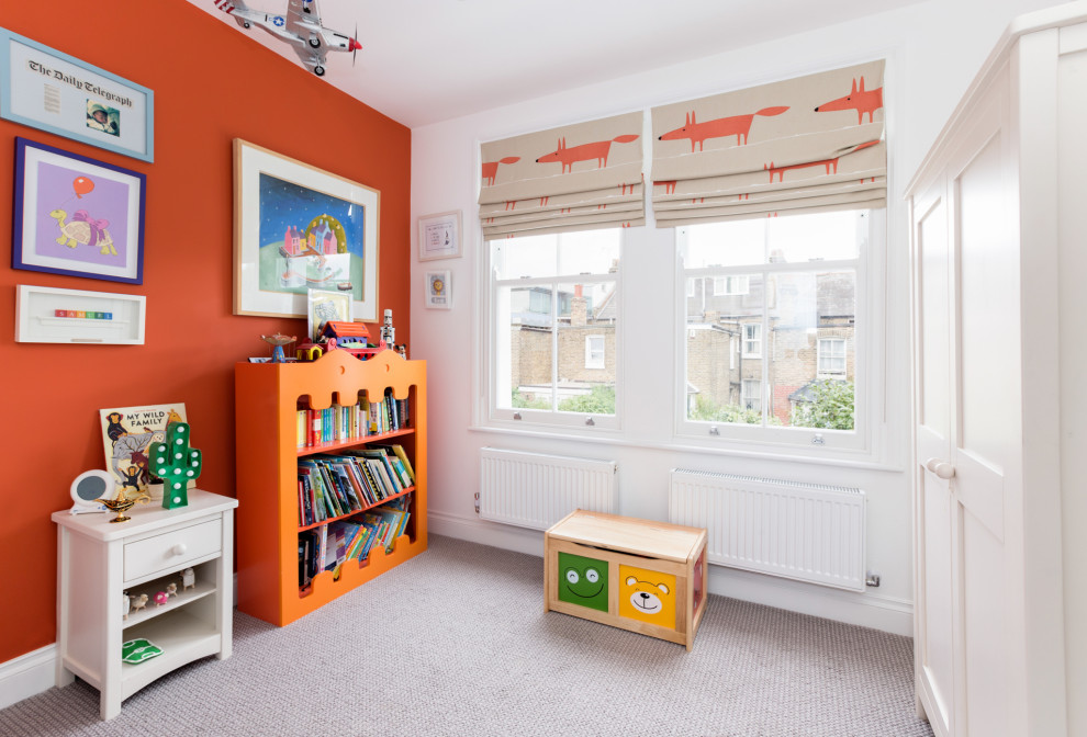 Design ideas for a classic gender neutral playroom in London with orange walls, carpet, grey floors and a feature wall.