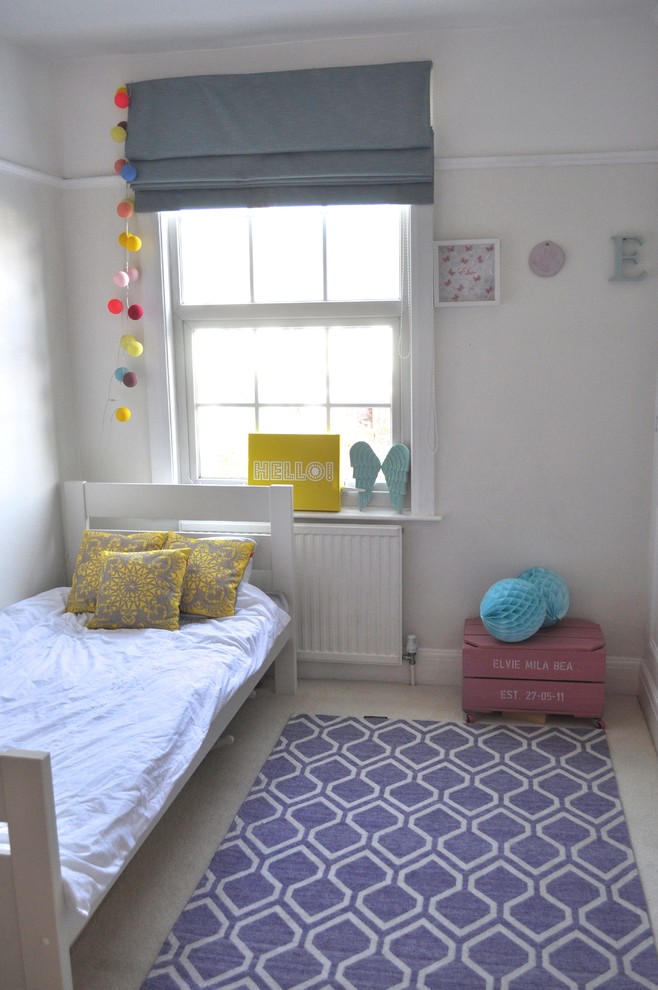 Inspiration for a medium sized contemporary kids' bedroom in London with carpet.