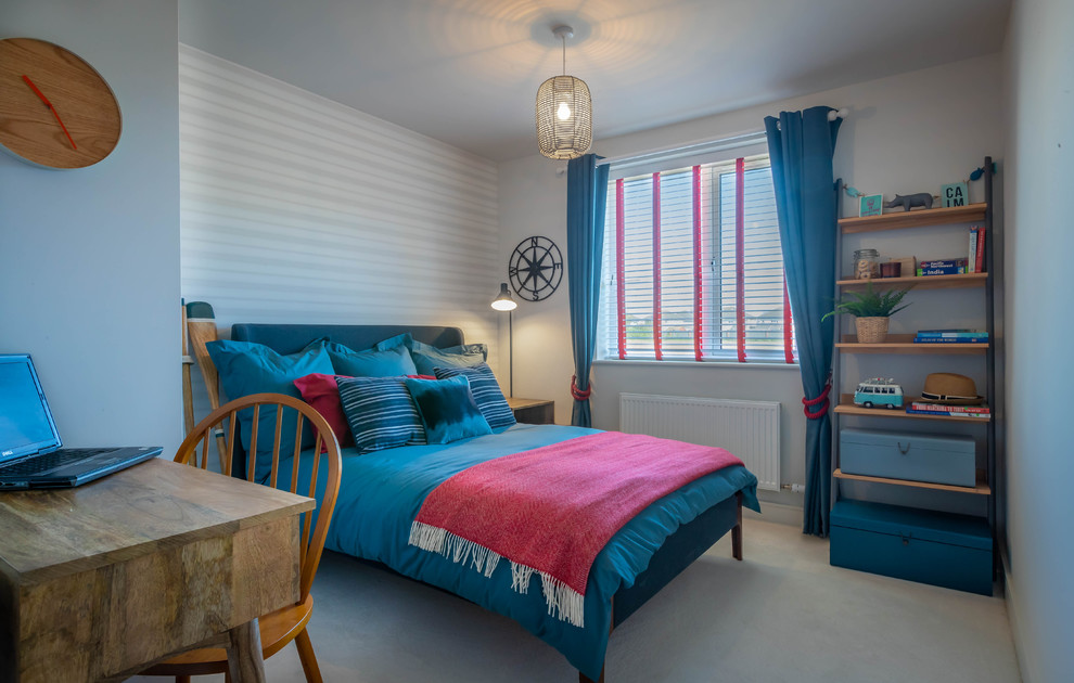 This is an example of a medium sized beach style teen’s room for boys in Dublin with grey walls, carpet and grey floors.