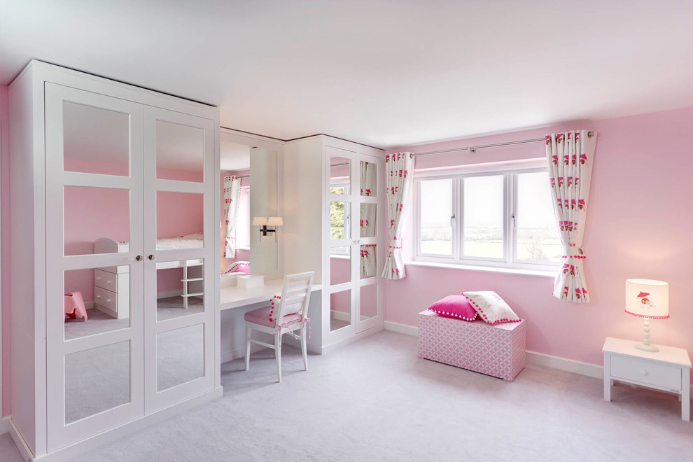 Inspiration for a small contemporary kids' bedroom in London with pink walls and carpet.