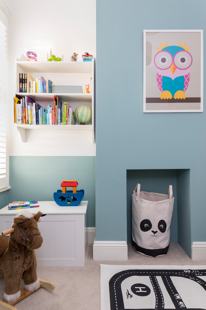 Mid-sized trendy gender-neutral carpeted and gray floor kids' bedroom photo in London with multicolored walls