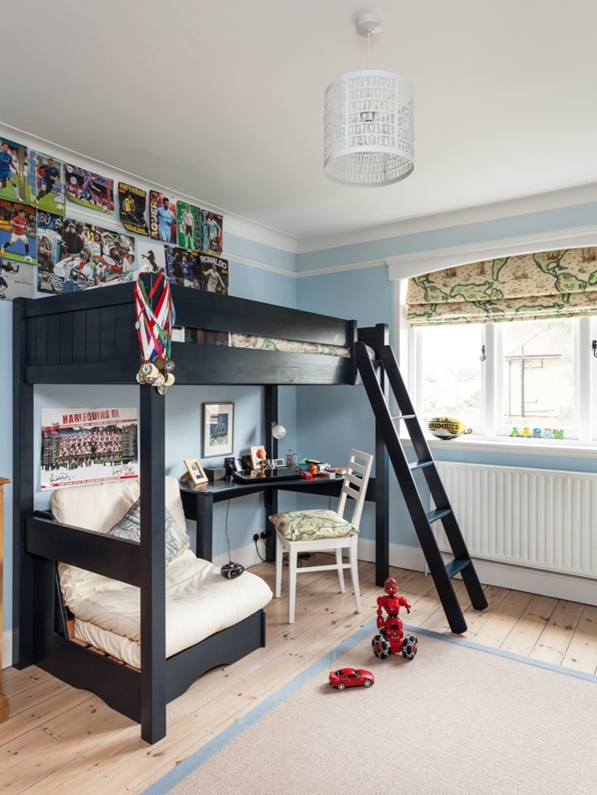 Farmhouse kids' bedroom in Surrey with blue walls.