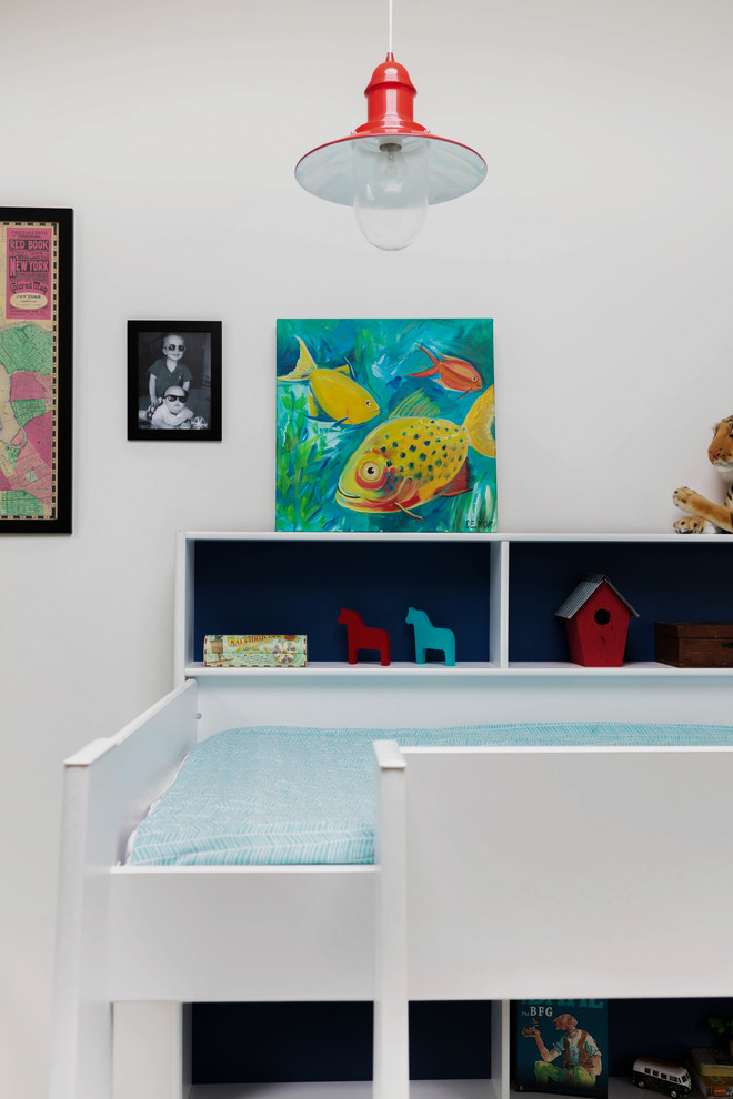 Design ideas for a large vintage children’s room for boys in London with white walls.