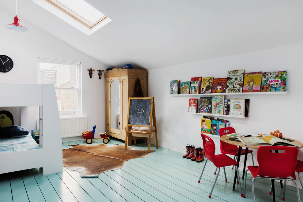This is an example of a large vintage children’s room for boys in London with white walls, painted wood flooring and turquoise floors.