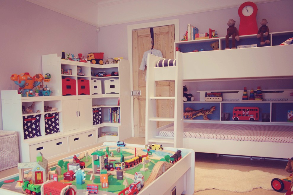Photo of a medium sized classic toddler’s room for boys in London with carpet.