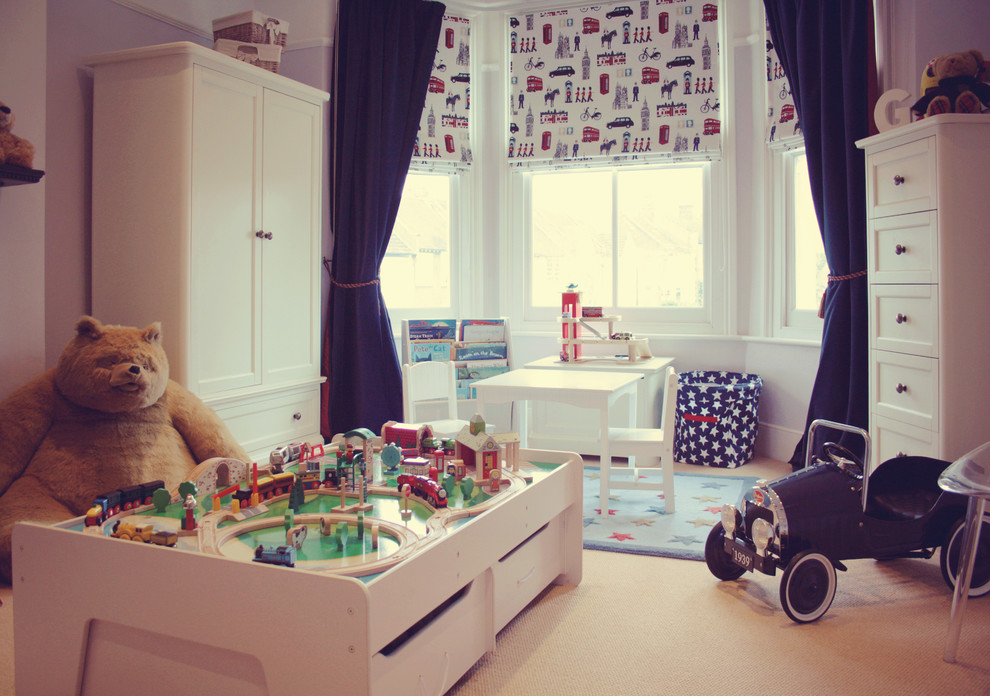 Inspiration for a large traditional toddler’s room for boys in London with carpet.