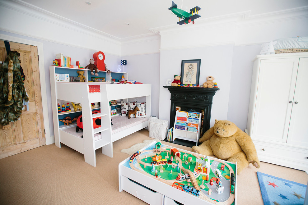 Design ideas for a medium sized traditional toddler’s room for boys in London with carpet.
