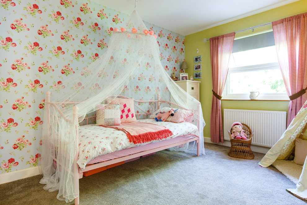 Photo of a classic children’s room for girls in Cambridgeshire with green walls, carpet and beige floors.