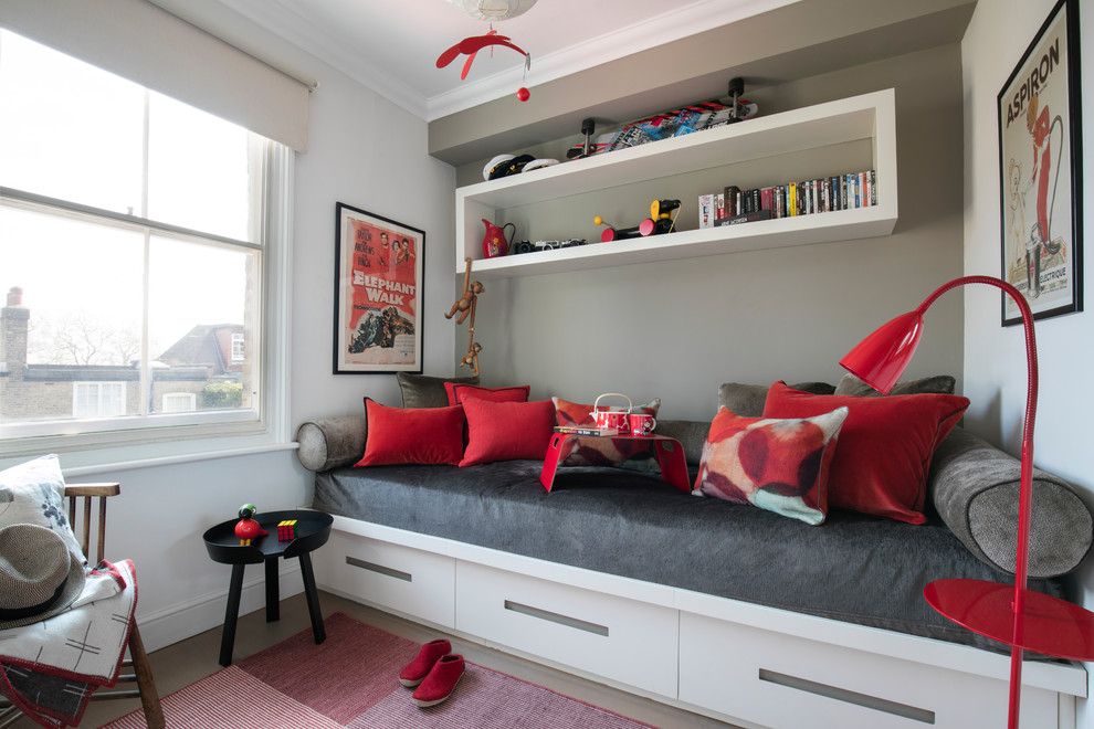 Design ideas for a contemporary kids' bedroom for girls in London with grey walls.