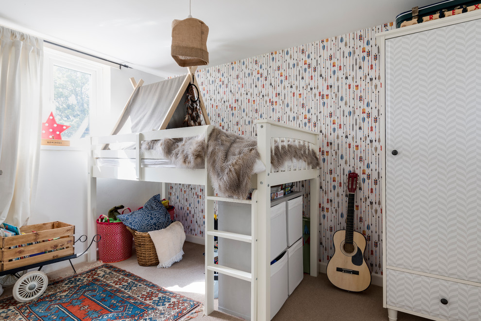 Design ideas for a medium sized bohemian gender neutral children’s room in London with carpet, beige floors and multi-coloured walls.