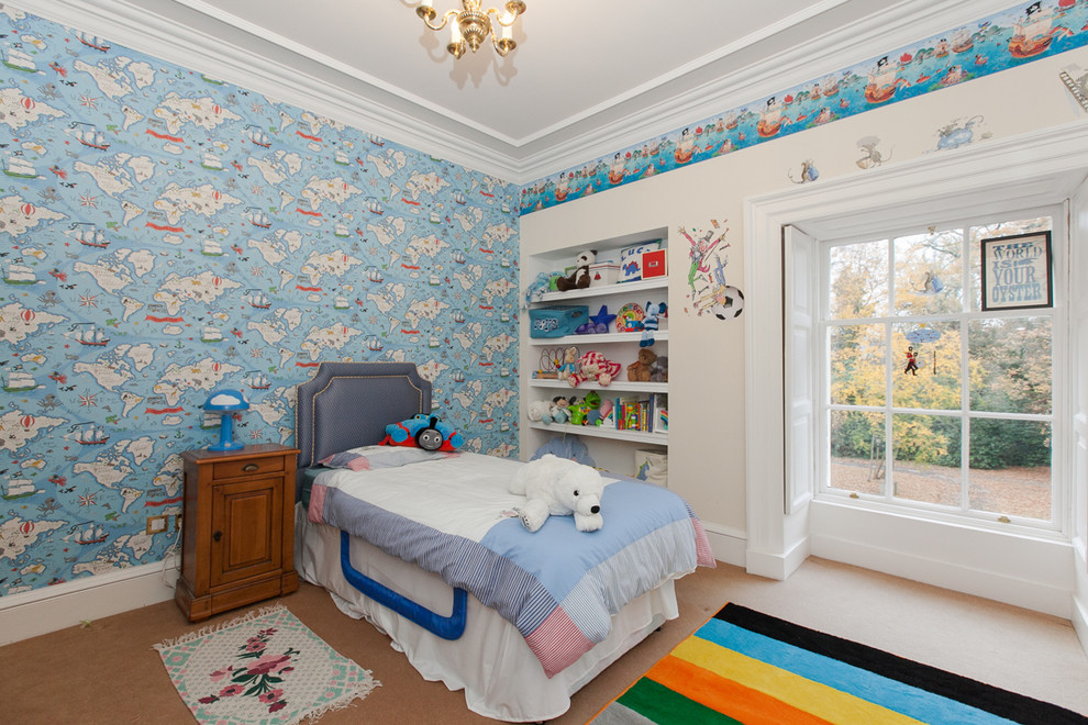 Foto di una cameretta per bambini tradizionale con pareti blu, moquette e pavimento beige