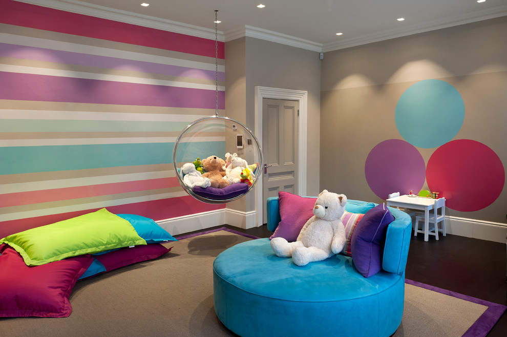 Photo of an expansive contemporary gender neutral kids' bedroom in Surrey with multi-coloured walls.