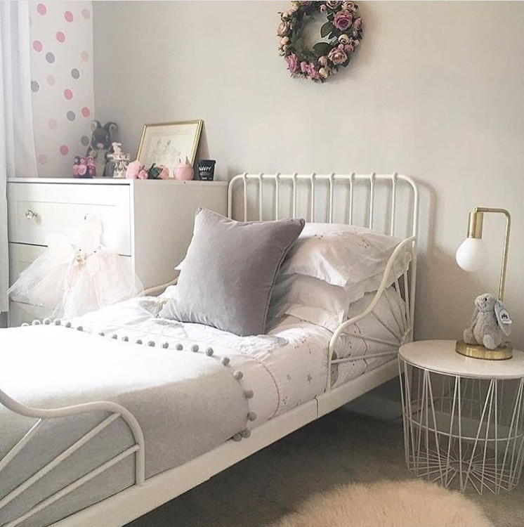 Inspiration for a small traditional toddler’s room for girls in Other with grey walls, carpet and grey floors.