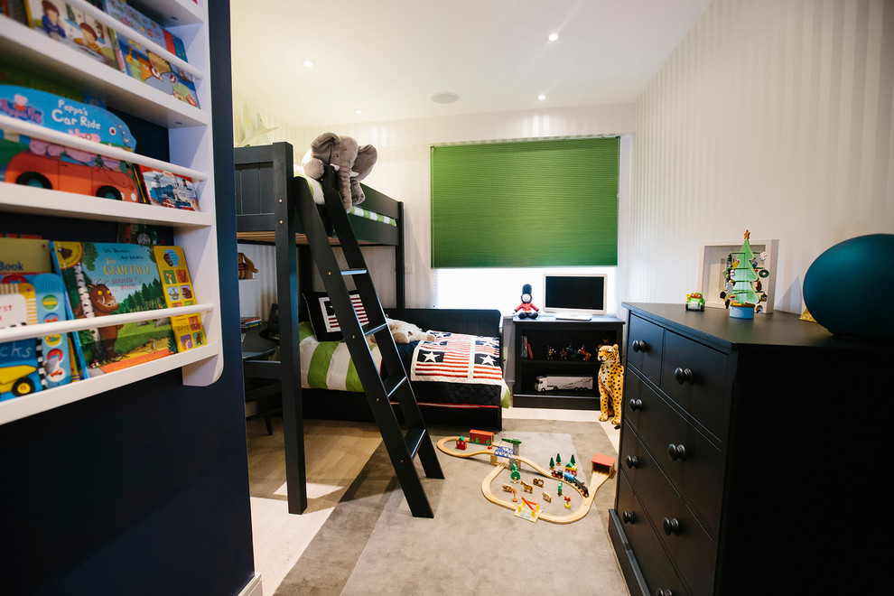 Photo of a medium sized modern toddler’s room for boys in London.