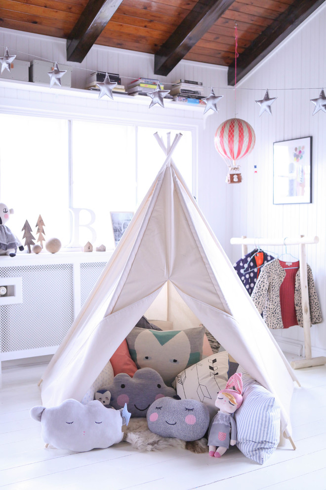 Inspiration for a medium sized scandi gender neutral kids' bedroom in Other with white walls and painted wood flooring.