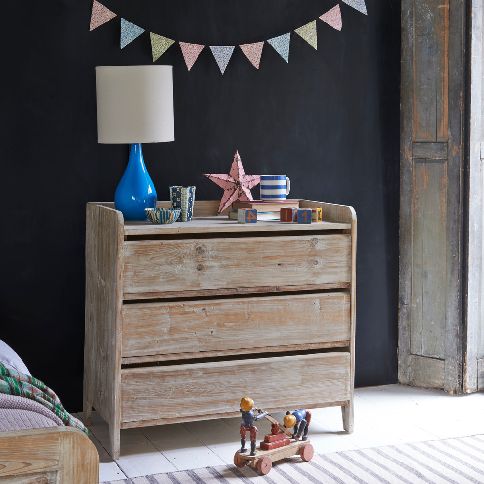 Design ideas for a small contemporary gender neutral children’s room in London with black walls and painted wood flooring.
