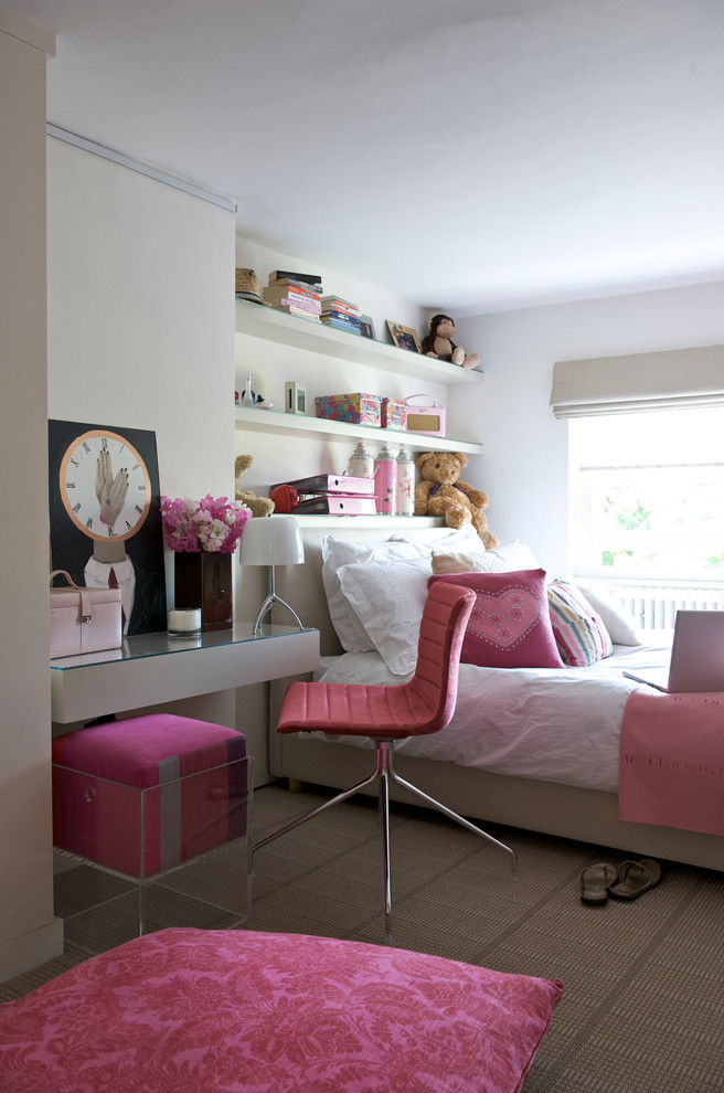 Photo of a medium sized contemporary teen’s room for girls in London with white walls and carpet.