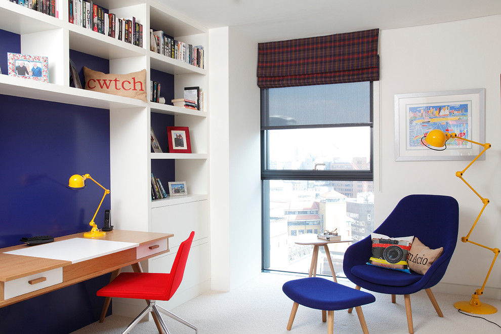 Contemporary gender neutral kids' study space in London with carpet.