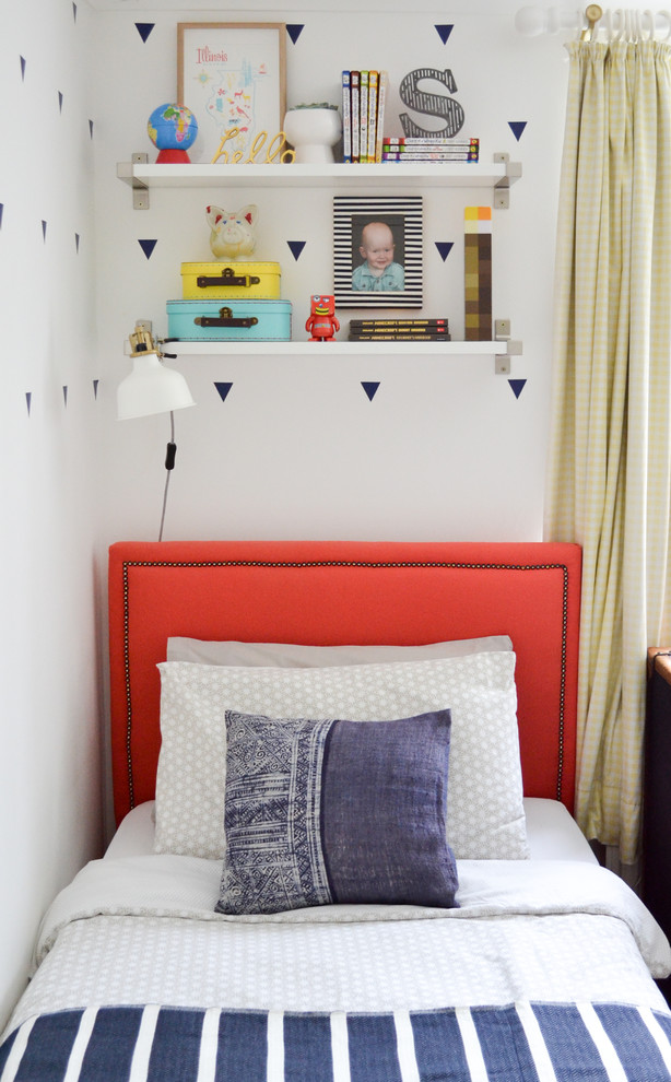 Design ideas for a small bohemian gender neutral children’s room in London with white walls and carpet.