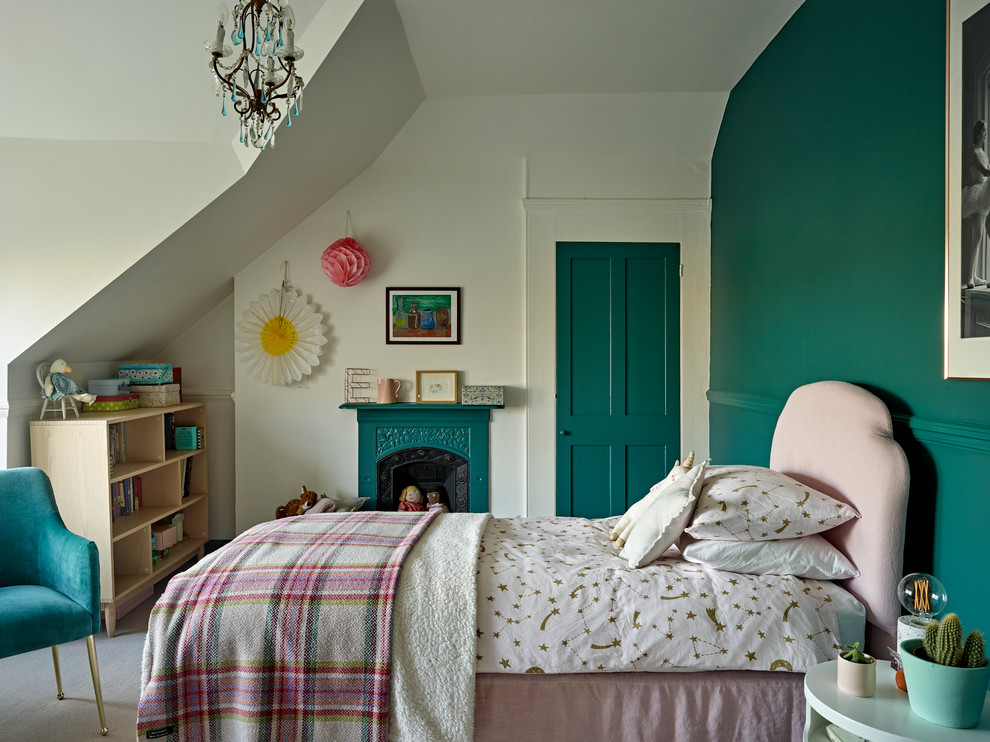 Photo of a medium sized victorian teen’s room for girls in London with green walls, carpet, grey floors and a dado rail.
