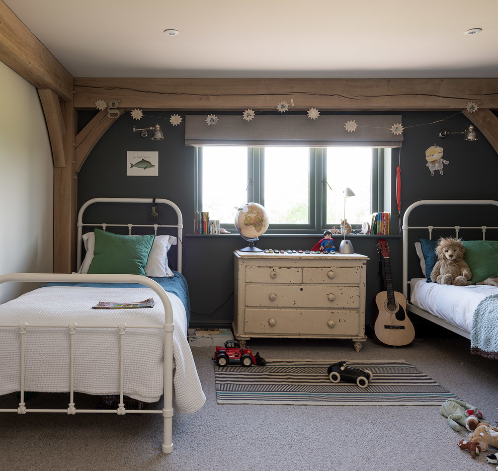 Photo of a farmhouse children’s room for boys in West Midlands with blue walls, carpet and grey floors.