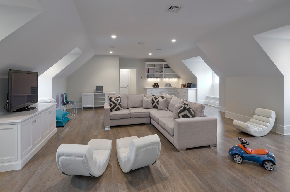 Inspiration for a large transitional gender-neutral medium tone wood floor kids' room remodel in New York with gray walls