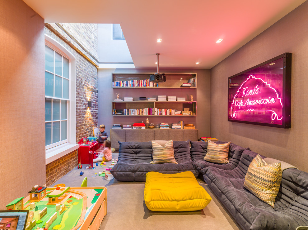 Large contemporary gender neutral playroom in London with carpet, beige floors and beige walls.