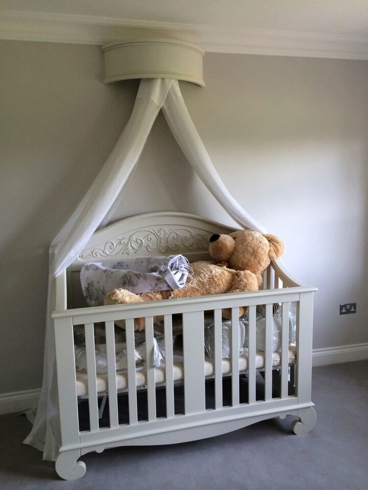 Photo of a medium sized classic gender neutral toddler’s room in Dorset with beige walls and carpet.