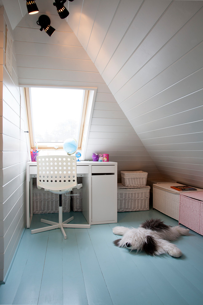 Contemporary kids' bedroom for girls in London with white walls, painted wood flooring and blue floors.