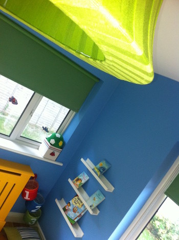 Inspiration for a contemporary kids' bedroom for boys in Other with blue walls.