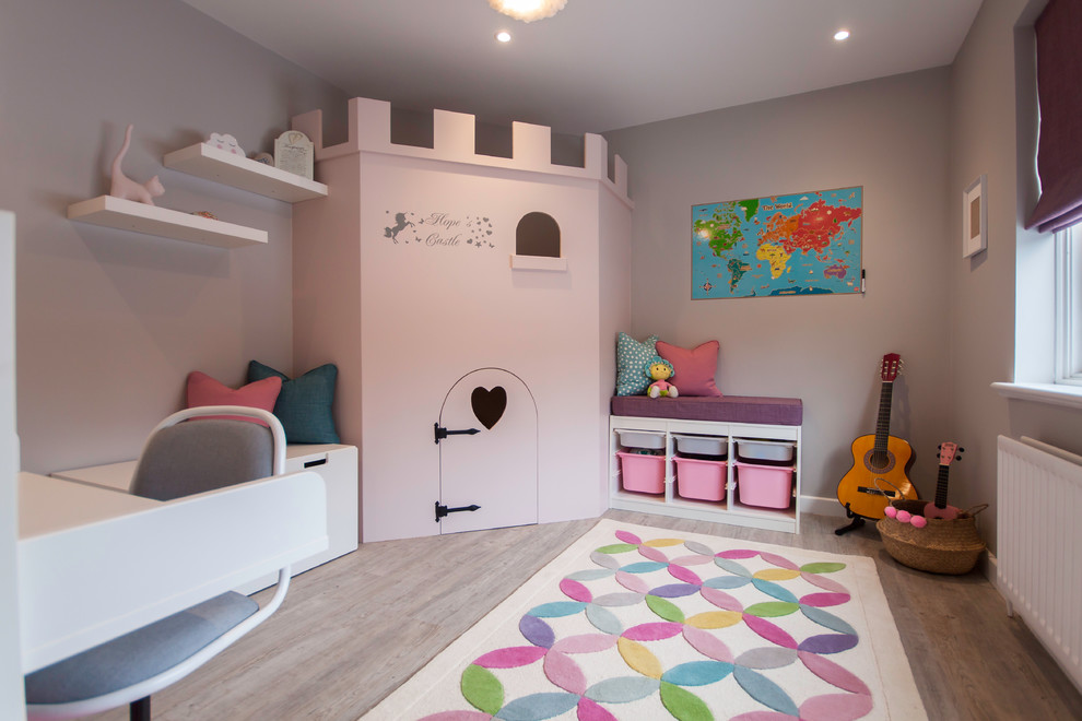 Design ideas for a medium sized contemporary kids' bedroom for girls in Buckinghamshire with grey walls, vinyl flooring and grey floors.
