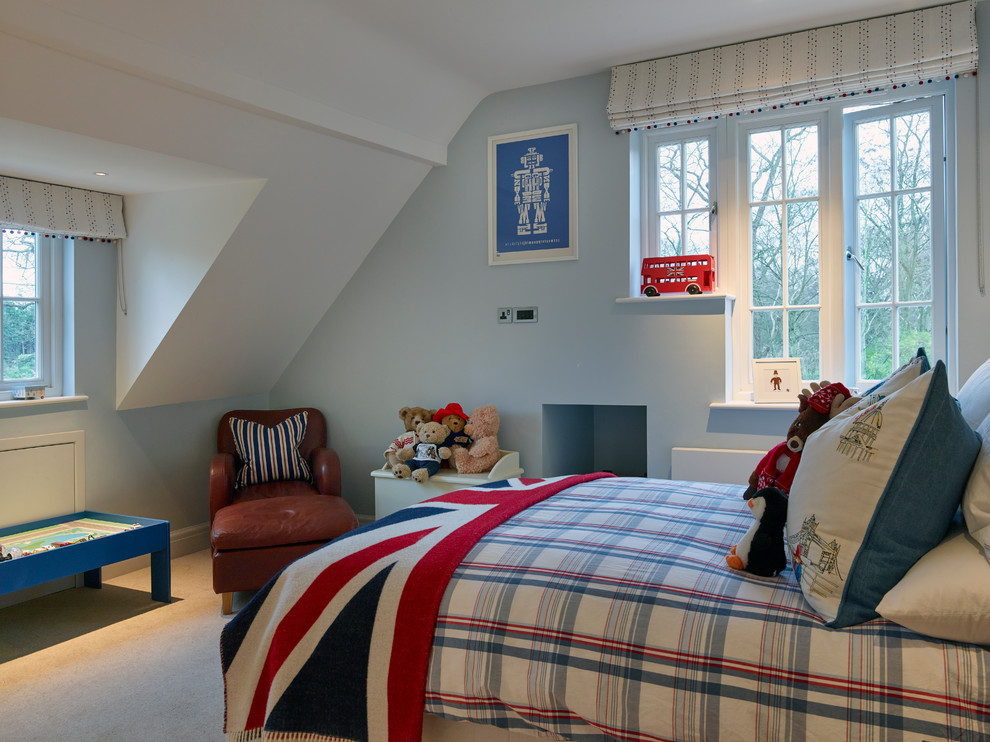 This is an example of a medium sized contemporary children’s room for boys in Sussex with blue walls and carpet.