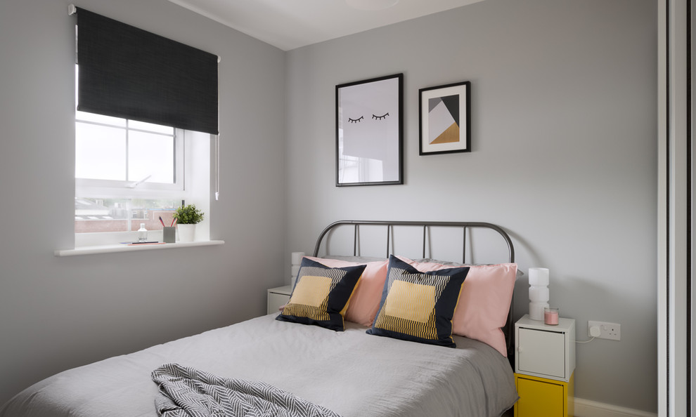 Photo of a medium sized contemporary teen’s room for girls in Other with grey walls.
