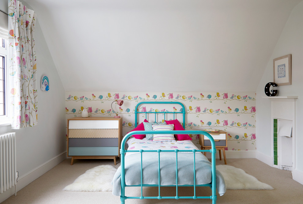 Inspiration for a classic children’s room for girls in Surrey with multi-coloured walls, carpet and beige floors.