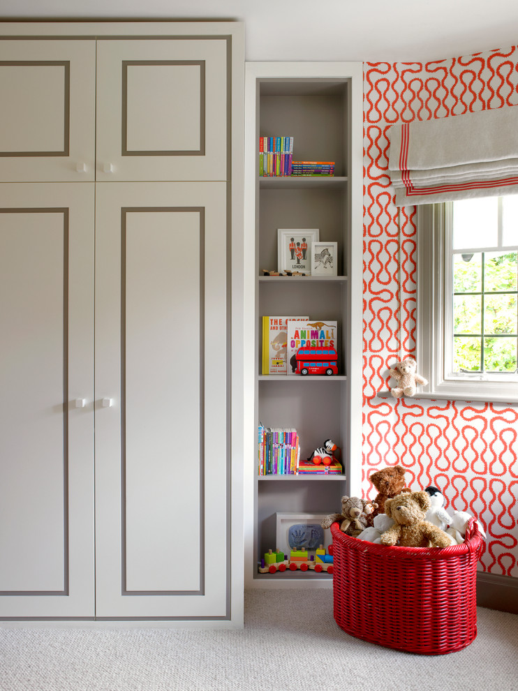 Example of a trendy gender-neutral carpeted kids' room design in London with multicolored walls