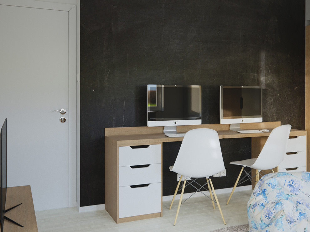 This is an example of a medium sized scandi kids' bedroom for boys in London with white walls and light hardwood flooring.