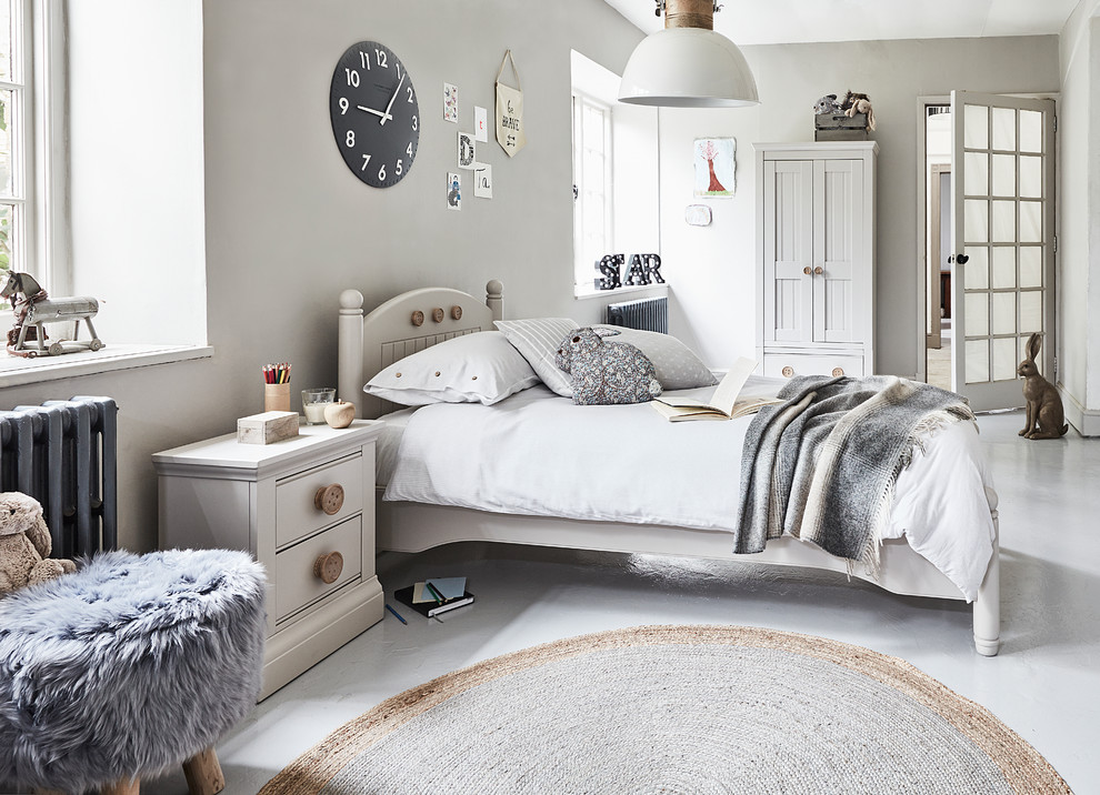 This is an example of a large beach style gender neutral children’s room in Other with grey walls, painted wood flooring and grey floors.