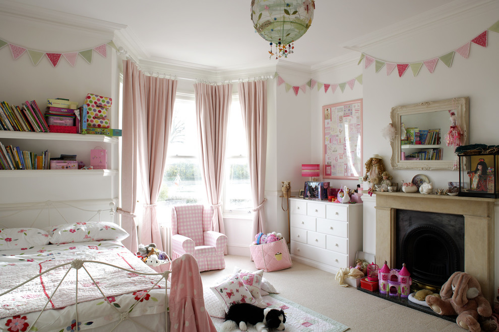 This is an example of a shabby-chic style kids' bedroom in London with a chimney breast.