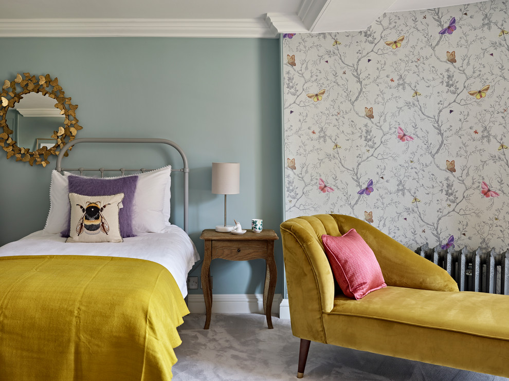 This is an example of a classic kids' bedroom in London with blue walls, carpet and grey floors.