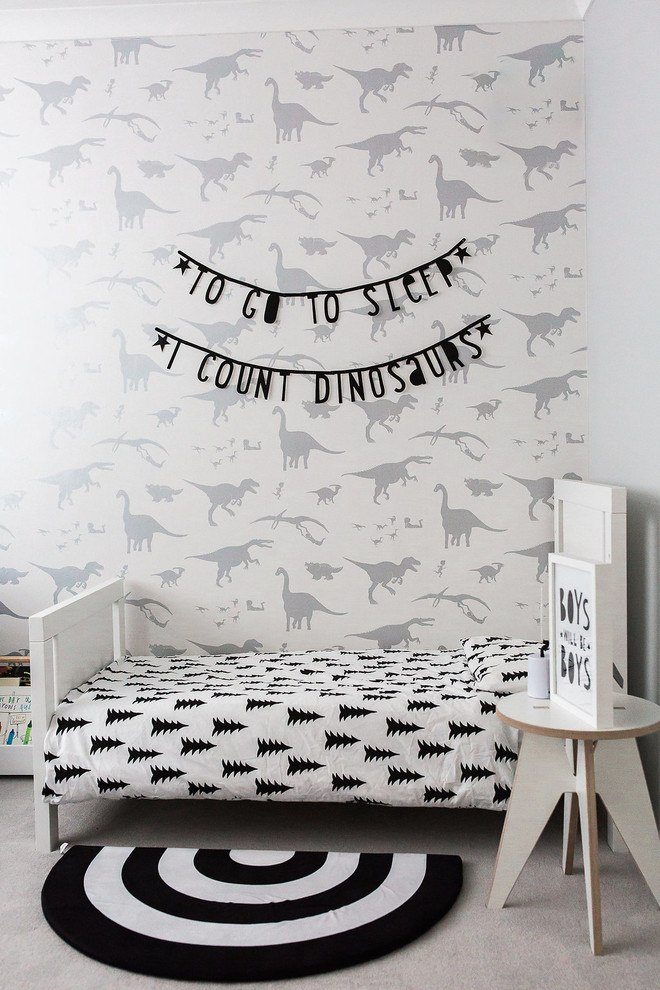 Inspiration for a scandinavian boy carpeted and gray floor childrens' room remodel in Surrey with gray walls