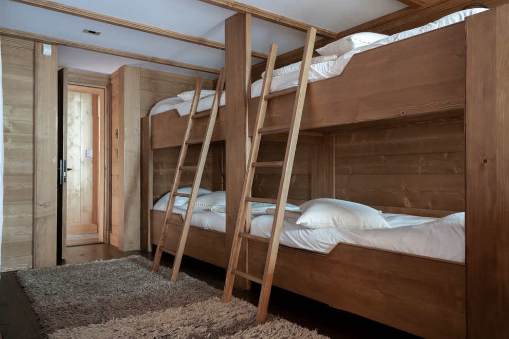 Kids' bedroom - mid-sized rustic gender-neutral dark wood floor and brown floor kids' bedroom idea in Other