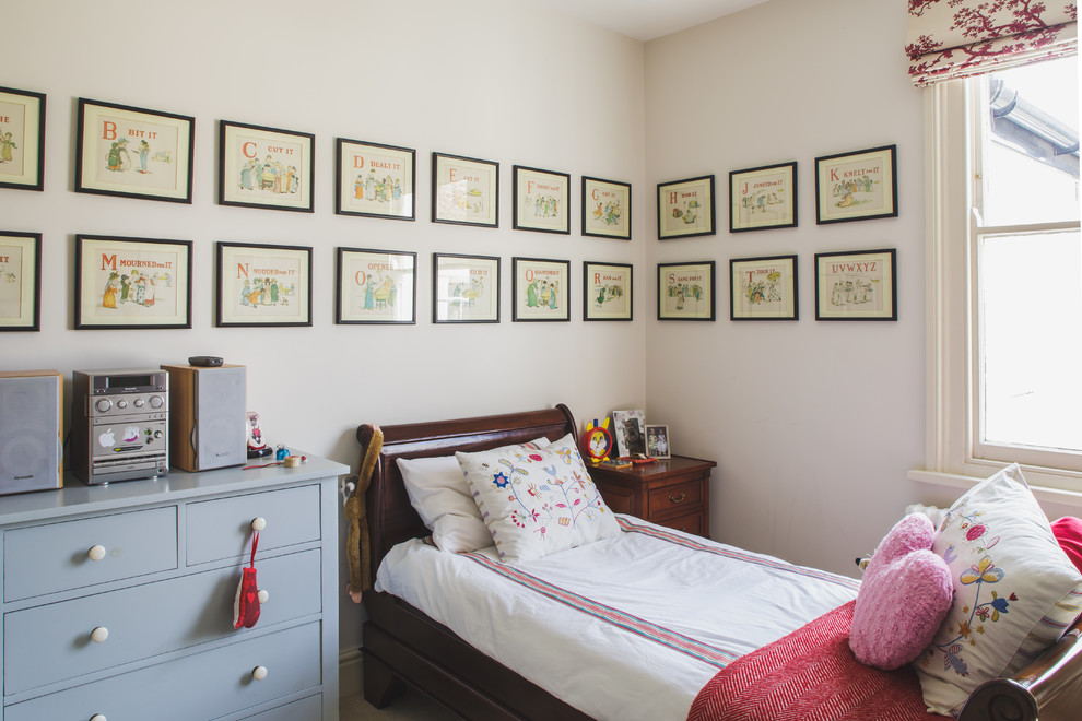 Example of a classic girl kids' room design in Other with white walls