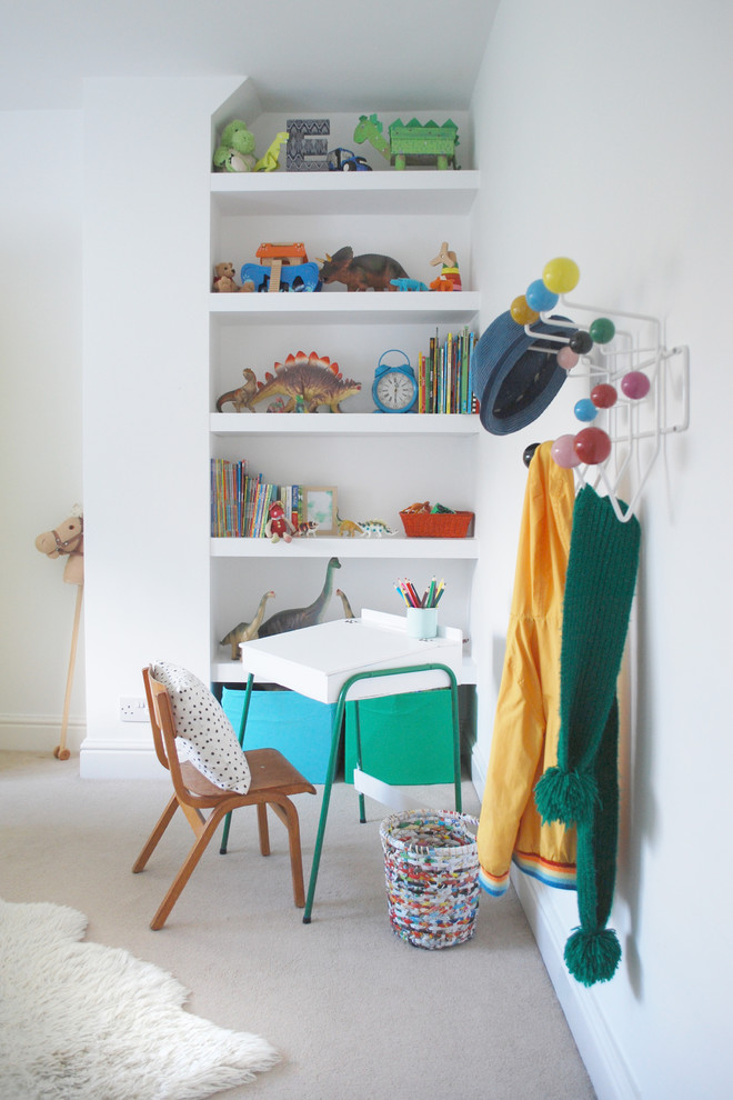 Modern children’s room for boys in Wiltshire with white walls and carpet.