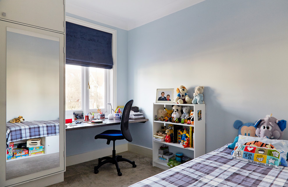 Design ideas for a medium sized contemporary gender neutral teen’s room in London with blue walls and carpet.
