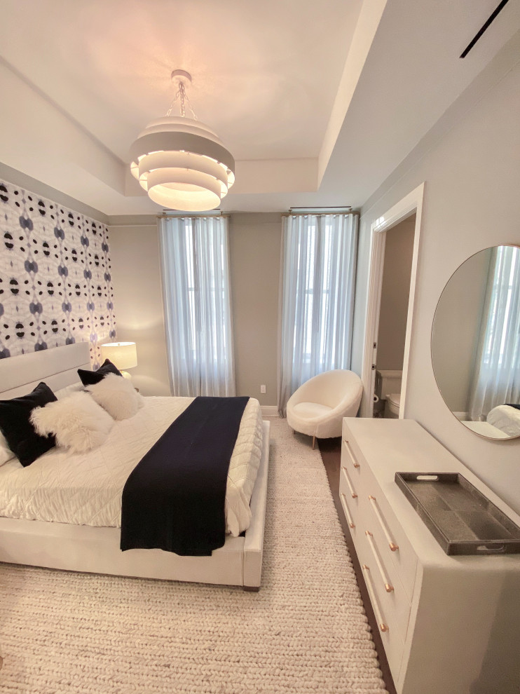 This is an example of a medium sized modern teen’s room for girls in New York with grey walls and carpet.