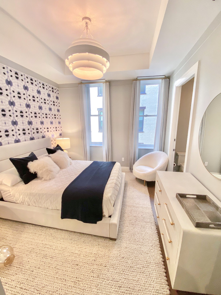 Ejemplo de dormitorio infantil minimalista de tamaño medio con paredes grises y moqueta