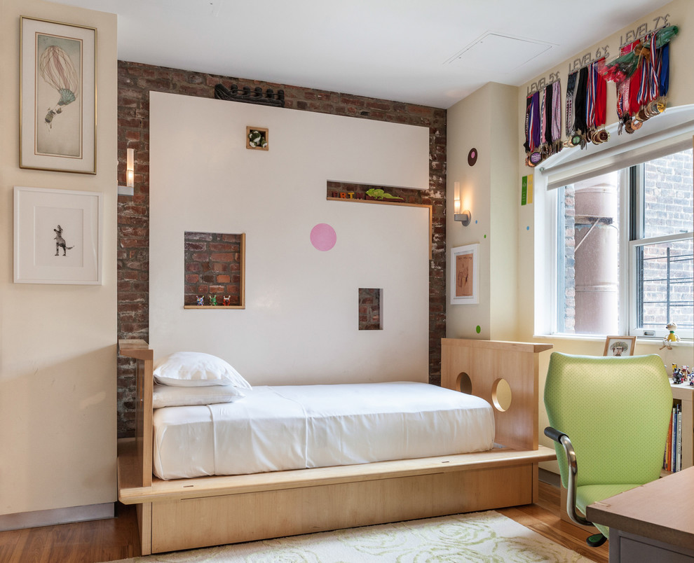 Kids' room - eclectic gender-neutral kids' room idea in New York with white walls